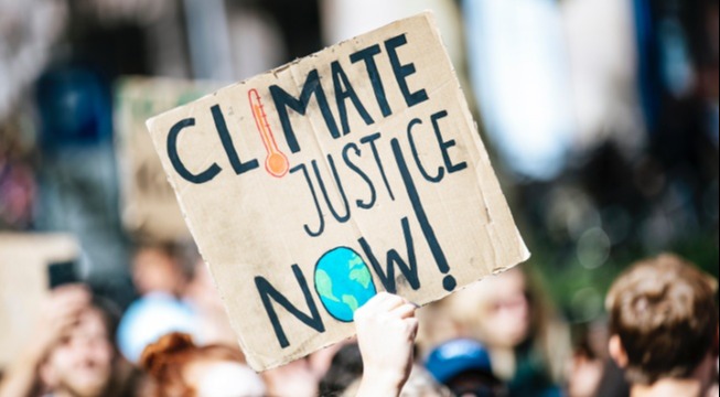 climate justice protest sign