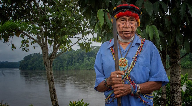 Achuar elder standing in front of Amazon River
