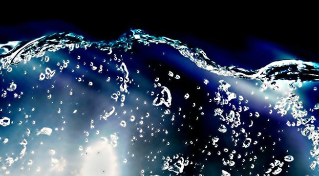 water flowing against black and blue background